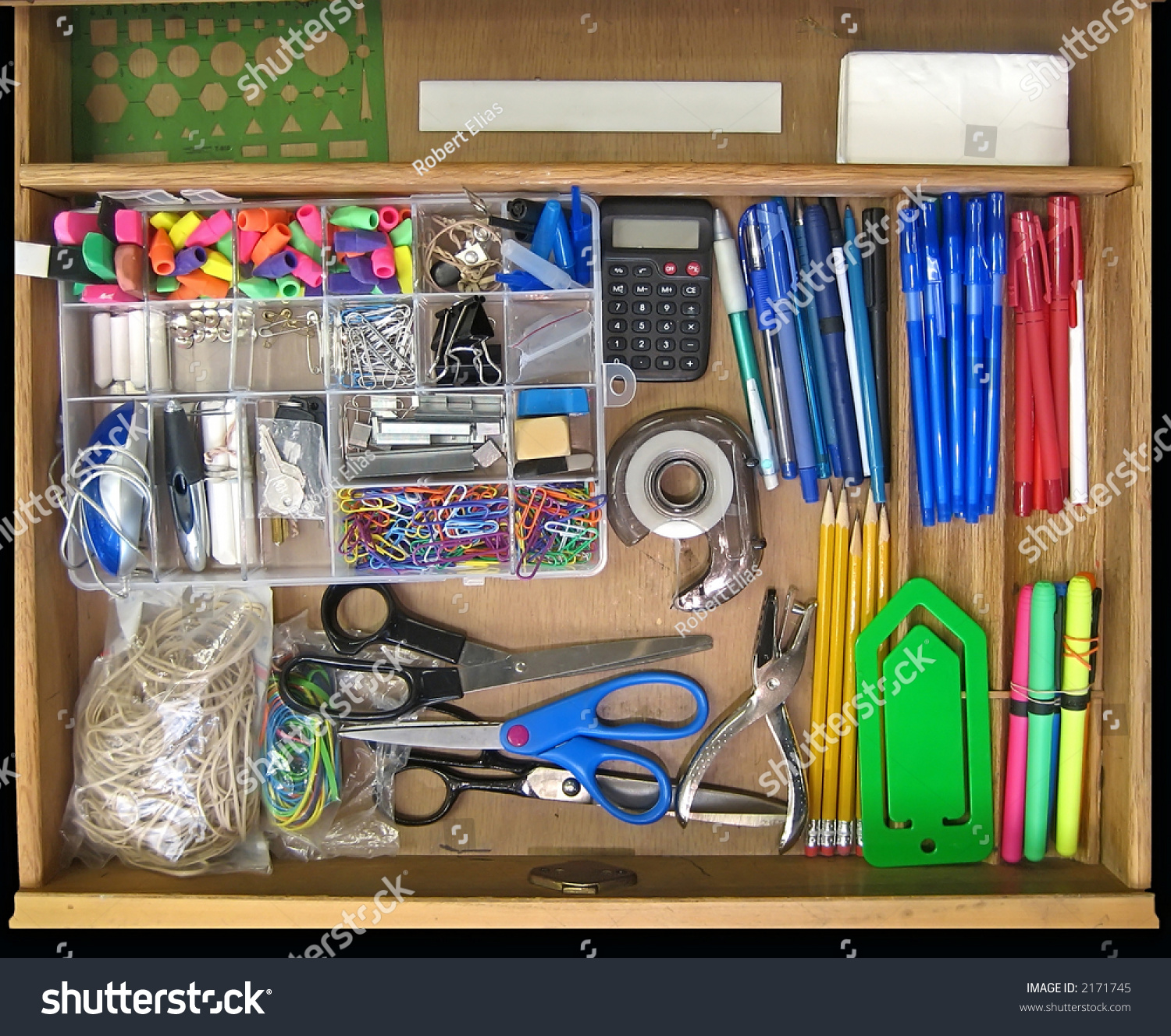 Open Teacher'S Desk Drawer Full Of Supplies. Stock Photo 2171745