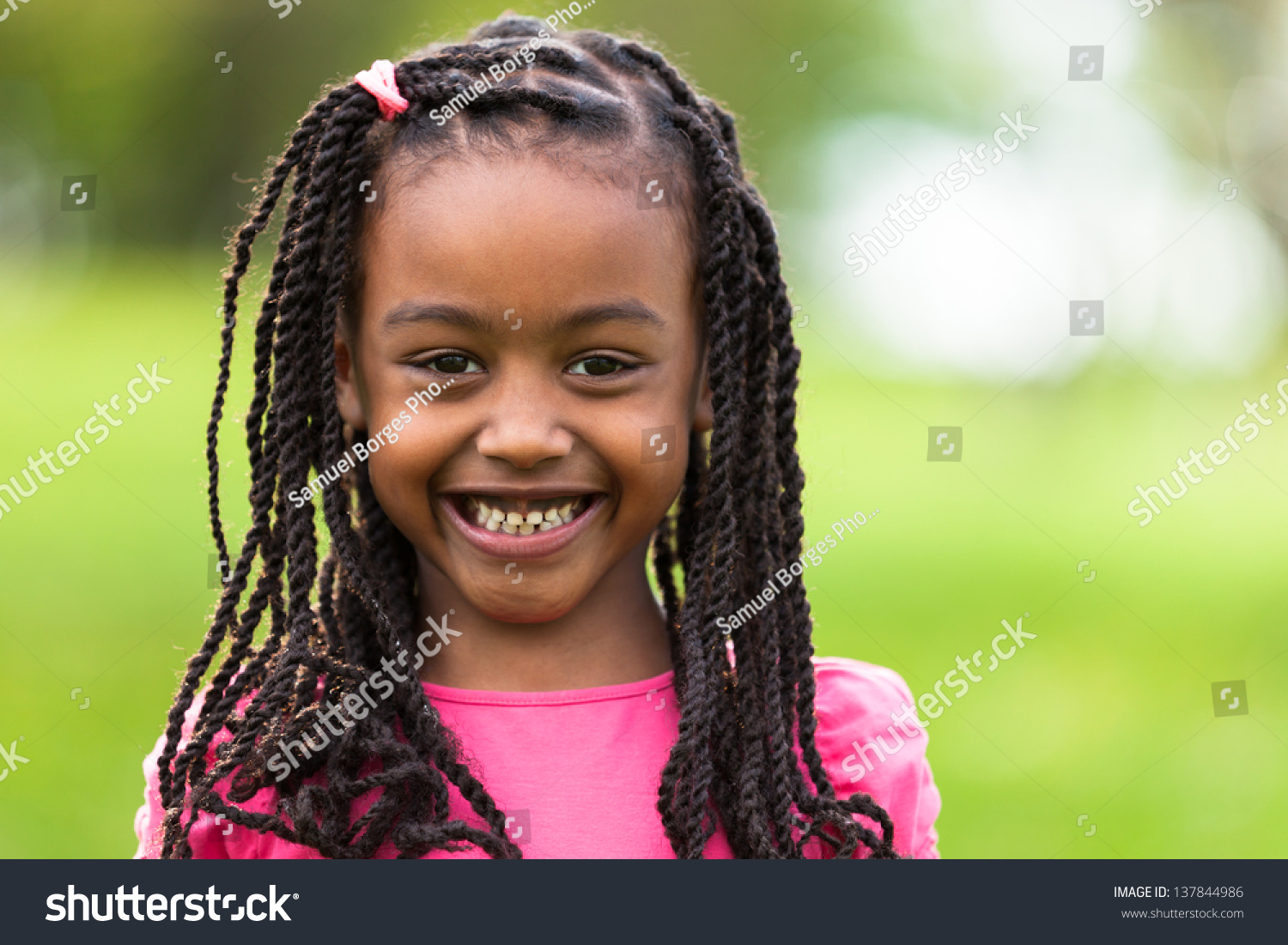 Outdoor Close Up Portrait Of A Cute Young Black Girl Smiling African