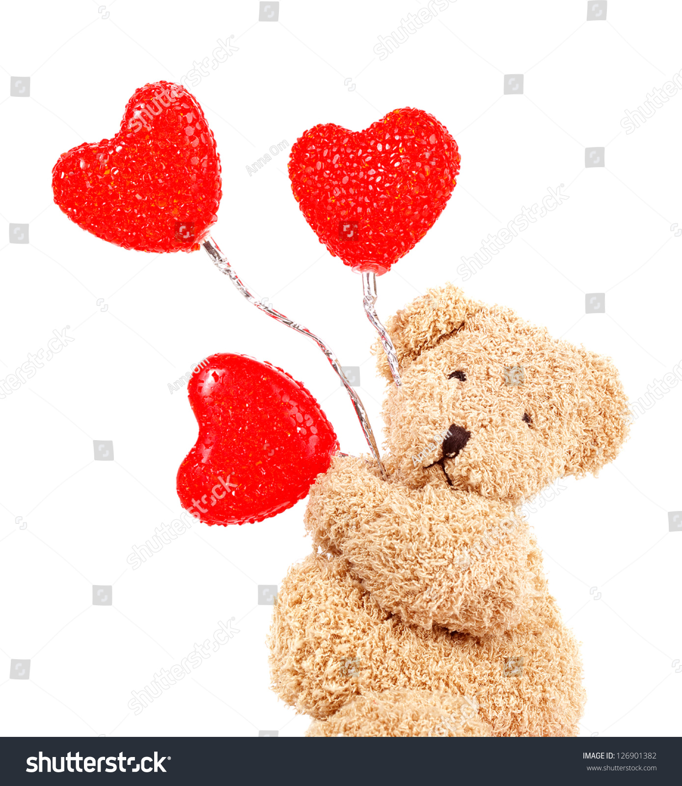 small teddy bear holding heart