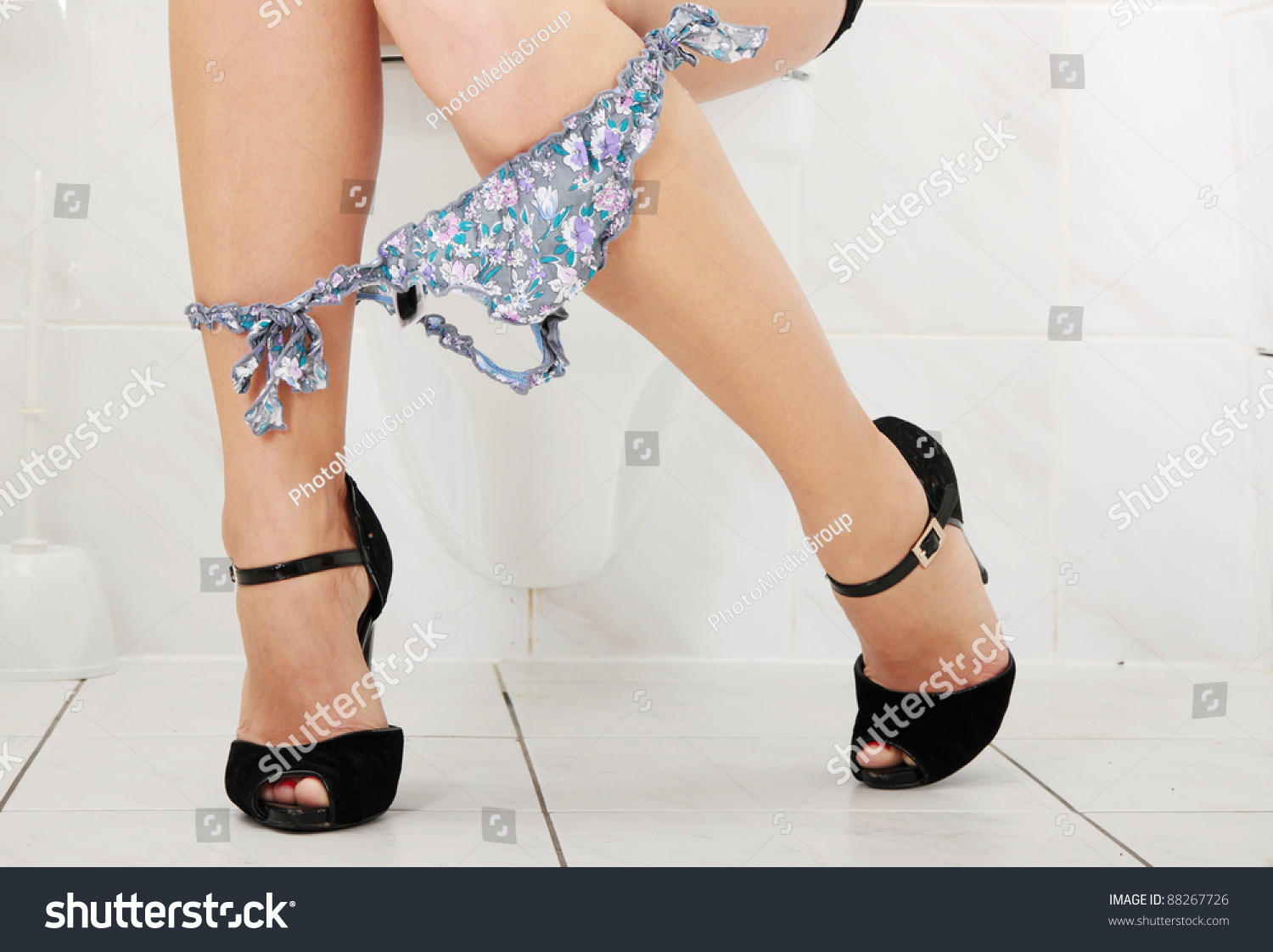woman sitting on toilet Stock photo and royalty-free 