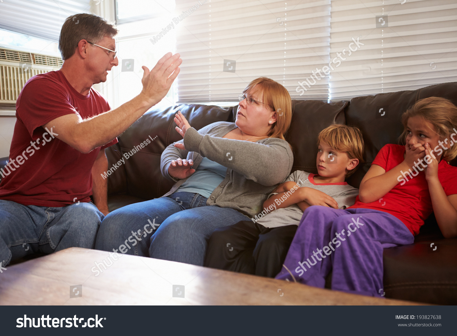 physically-abusive-father-family-on-sofa-stock-photo-193827638