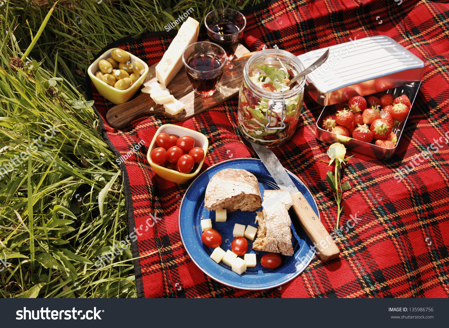 Picnic With Different Sorts Of Snacks On A Blanket Stock Photo