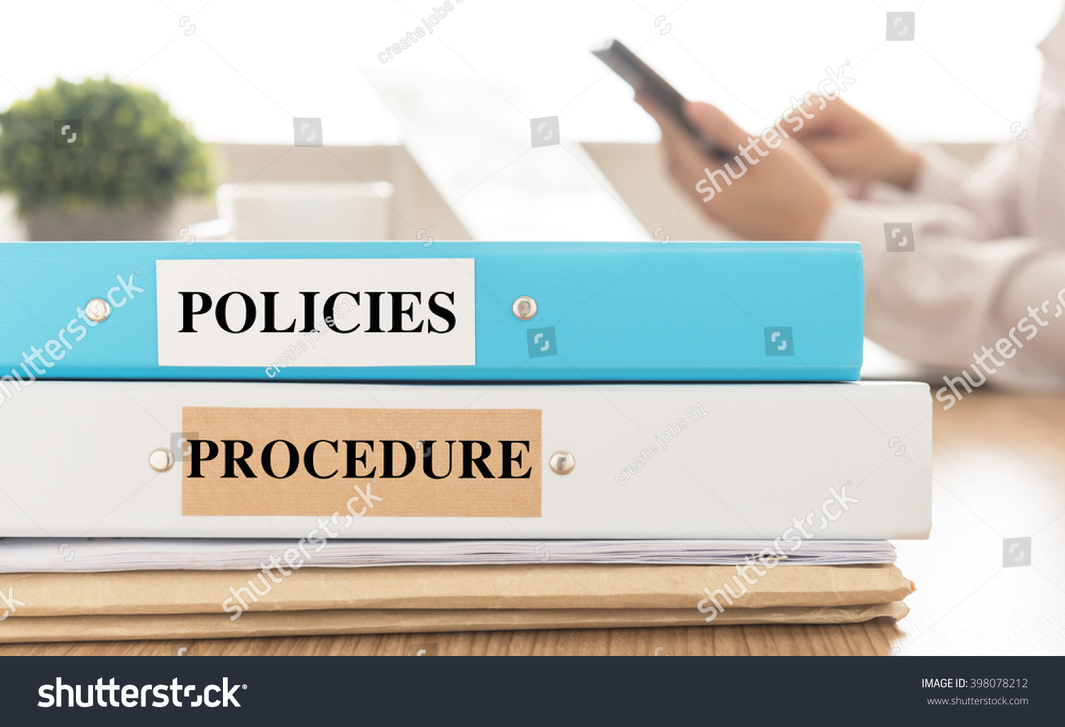 policies-and-procedures-doucument-place-on-desk-in-meeting-room-policy