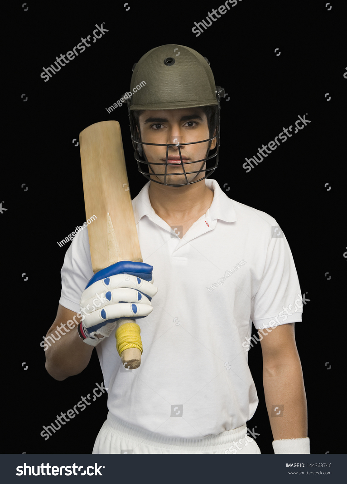 Portrait Of A Cricket Batsman Holding A Cricket Bat Stock Photo ...