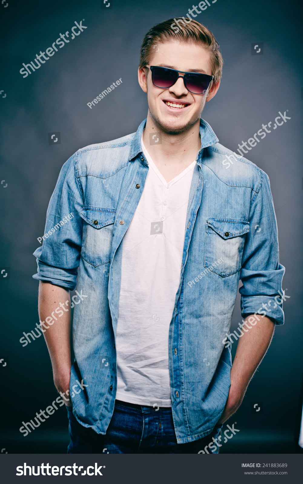 Portrait Of A Fashionable Man In Denim Jacket Stock Photo