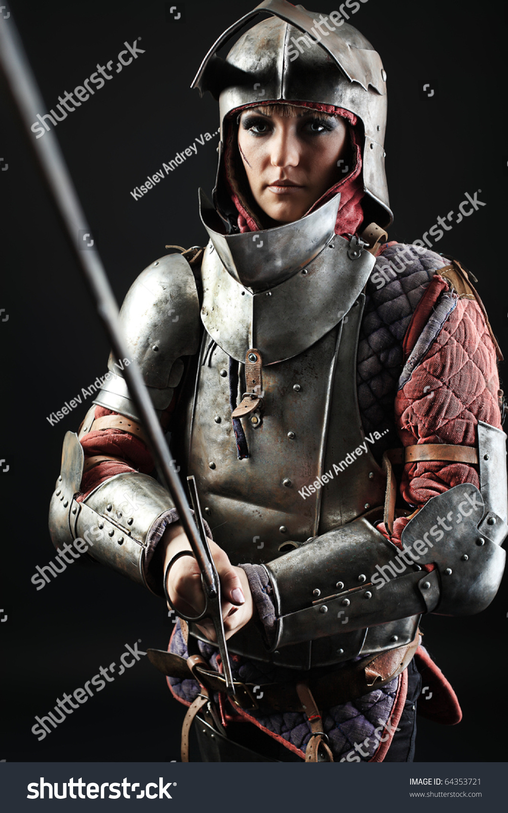 Portrait Of A Medieval Female Knight In Armour Over Black Background