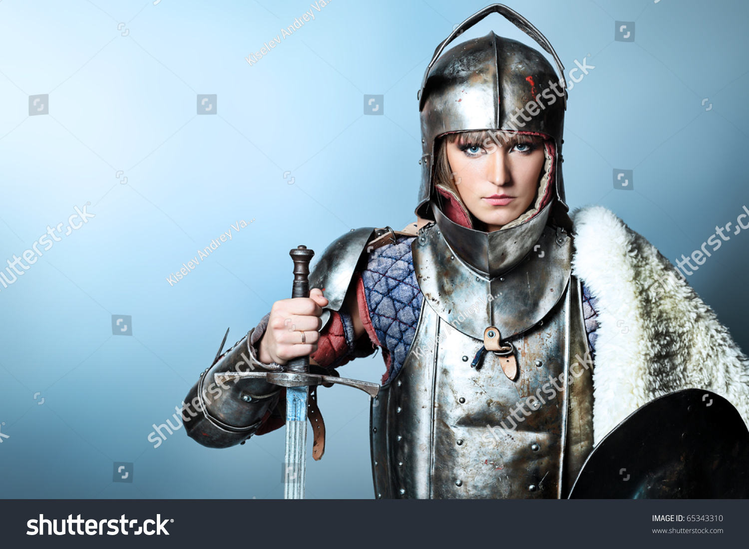 Portrait Of A Medieval Female Knight In Armour Over Grey Background