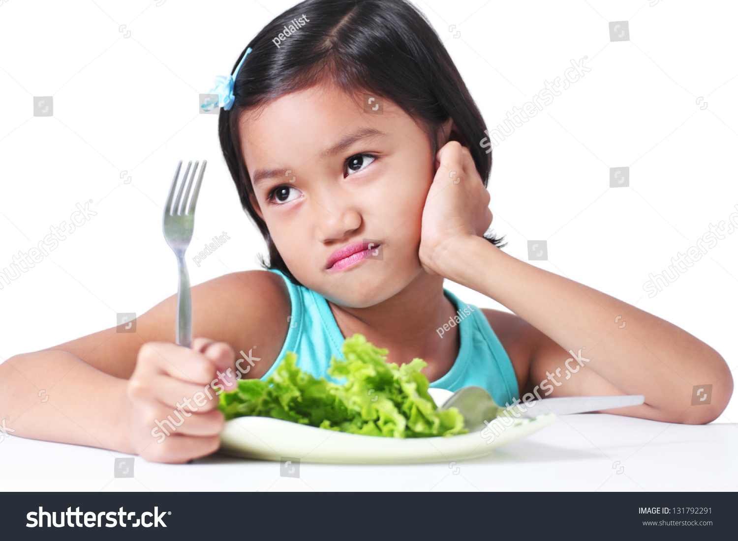 Portrait Of A Young Girl Who Don'T Like Eating Vegetables. Stock Photo ...