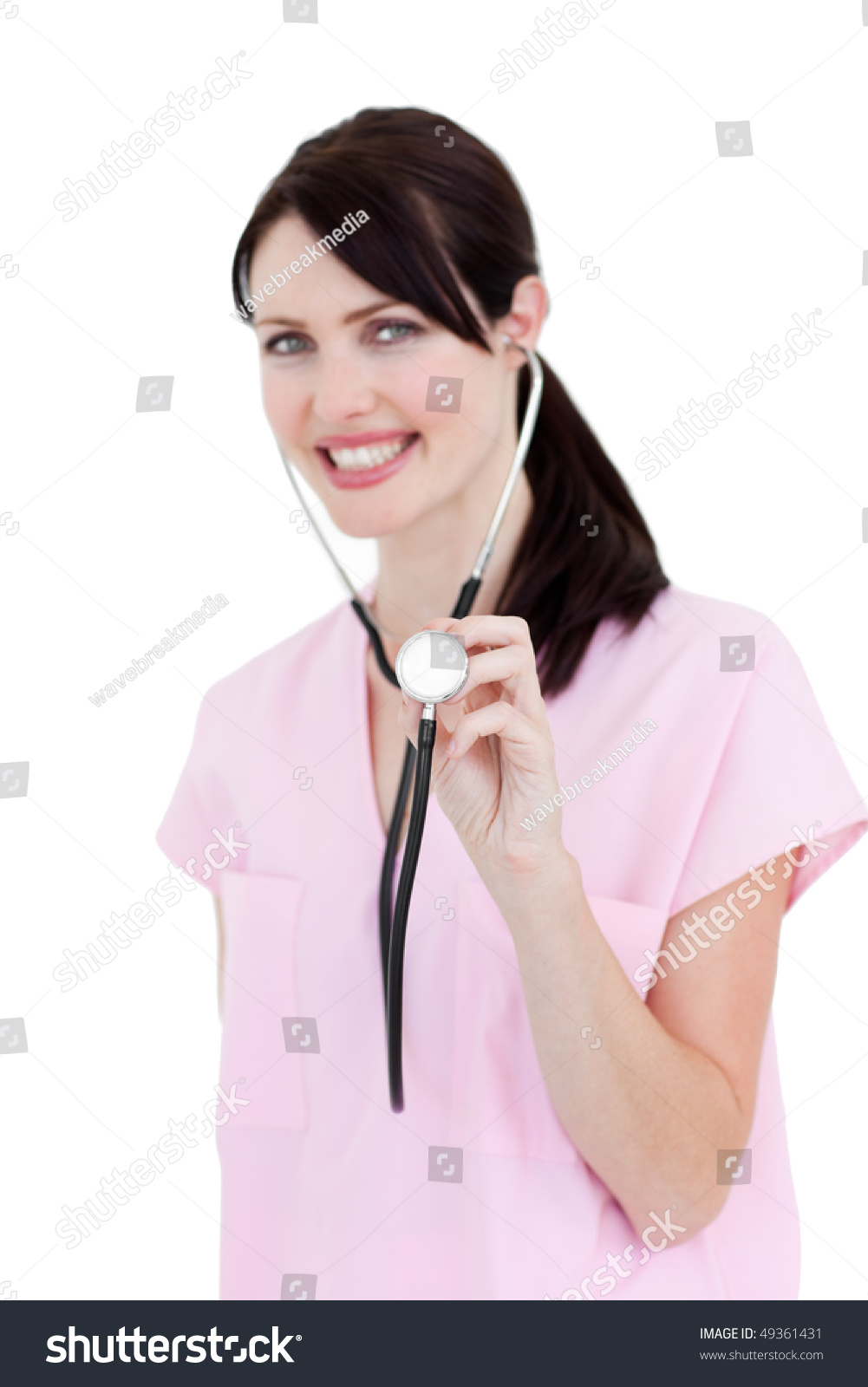 Nurse Posing On A Gray Background Holding A Stethoscope In 