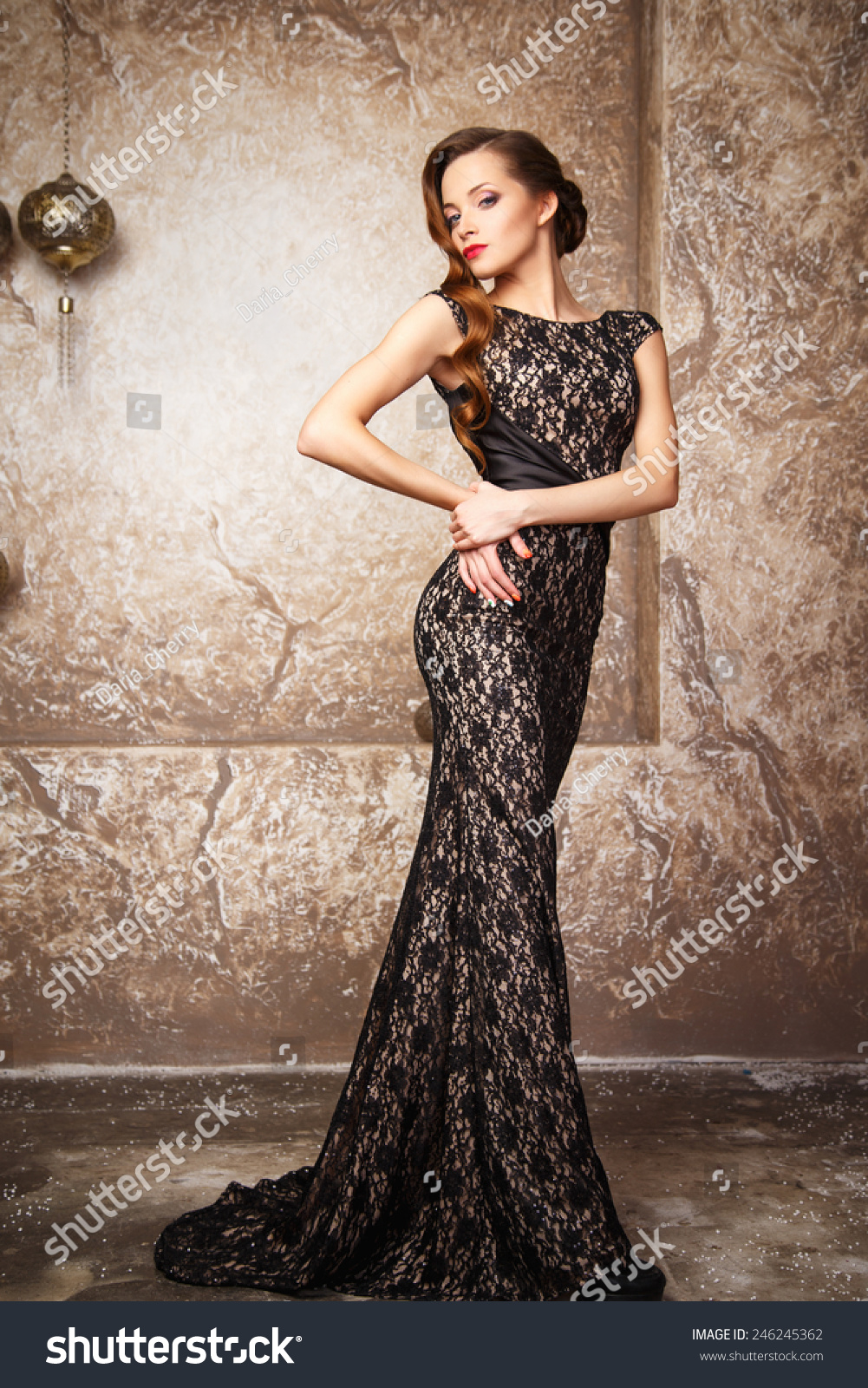 http://image.shutterstock.com/z/stock-photo-portrait-of-beautiful-elegant-young-woman-in-gorgeous-evening-dress-246245362.jpg