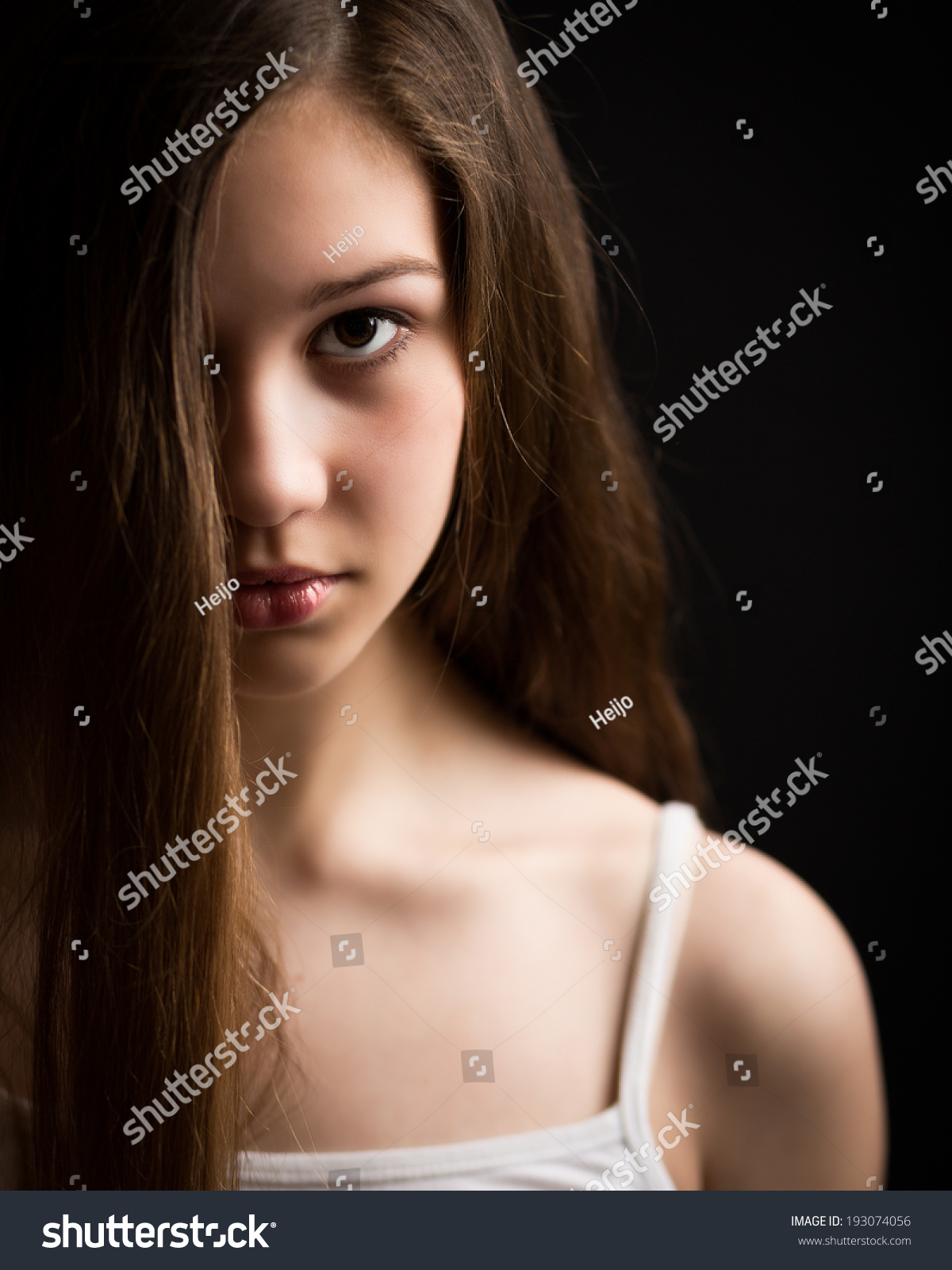 Portrait Of Beautiful Teenage Girl With Long Hair Coverin