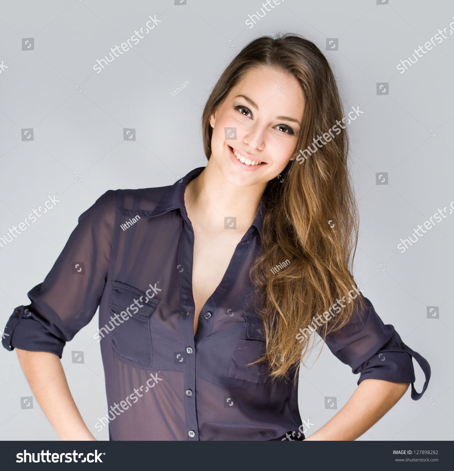 Portrait Of Cute Fashionable Young Brunette Woman In Dar
