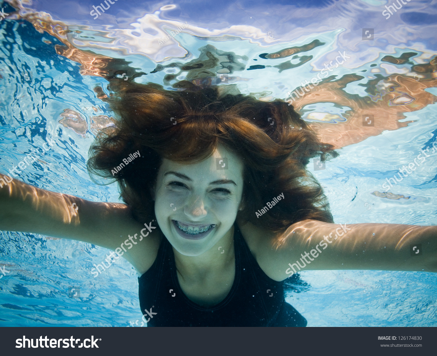 Portrait Of Young Woman Swimming Underwater Stock Photo 126174830 ...