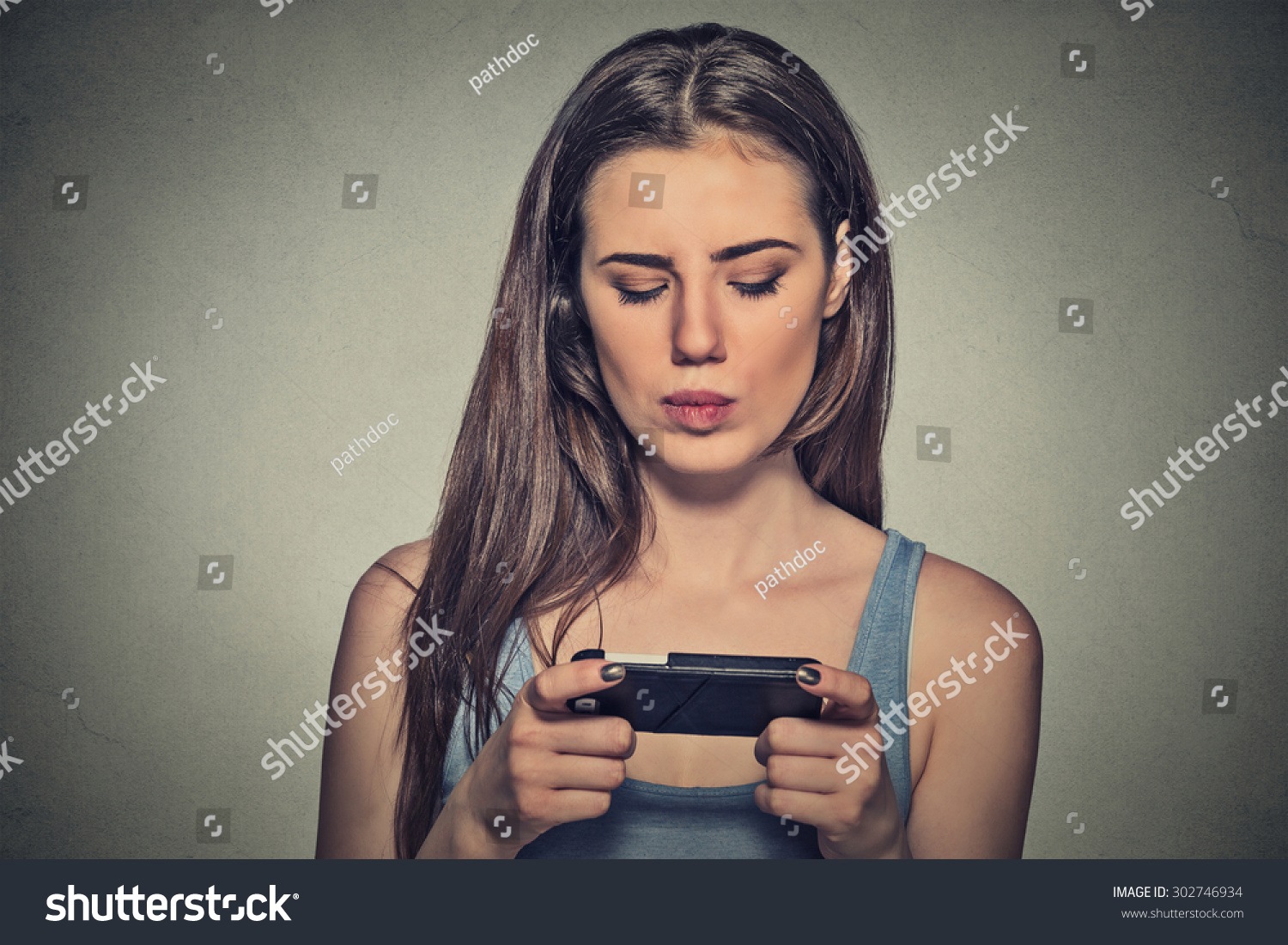 Portrait Young Angry Woman Unhappy Annoyed By Something Someone On Her Cell Phone Texting 9089