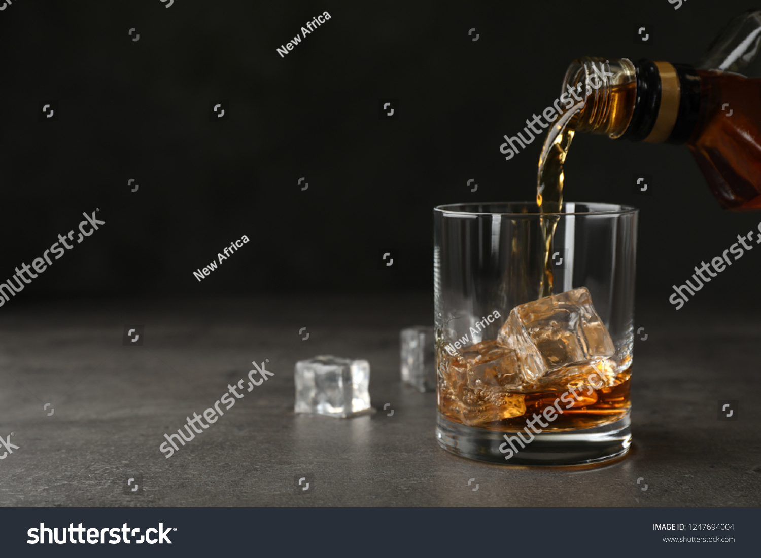 Pouring Whiskey Bottle Into Glass Ice Stock Photo 1247694004 Shutterstock