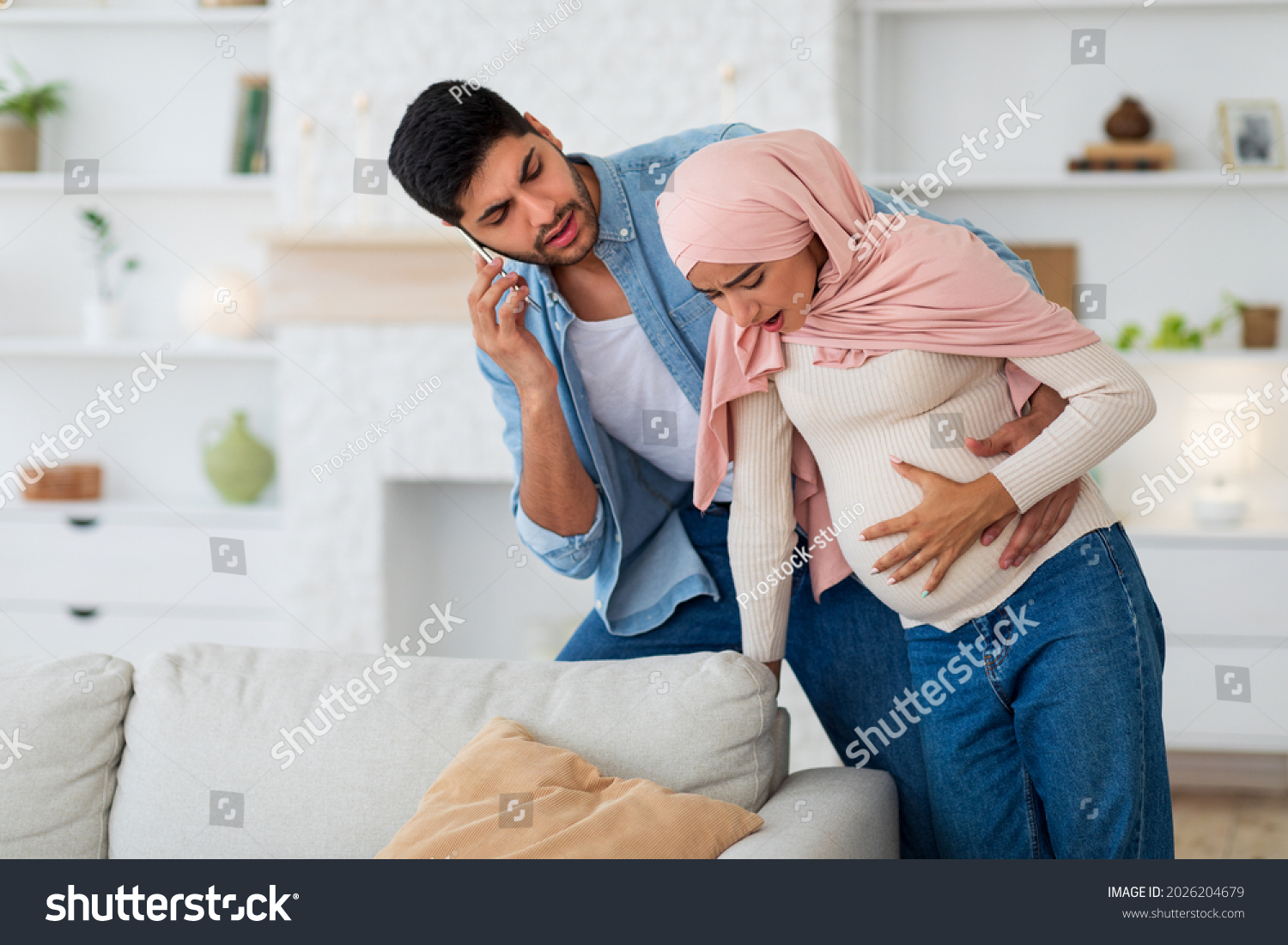 Pregnant Muslim Woman Having Prenatal Contractions Stock Photo