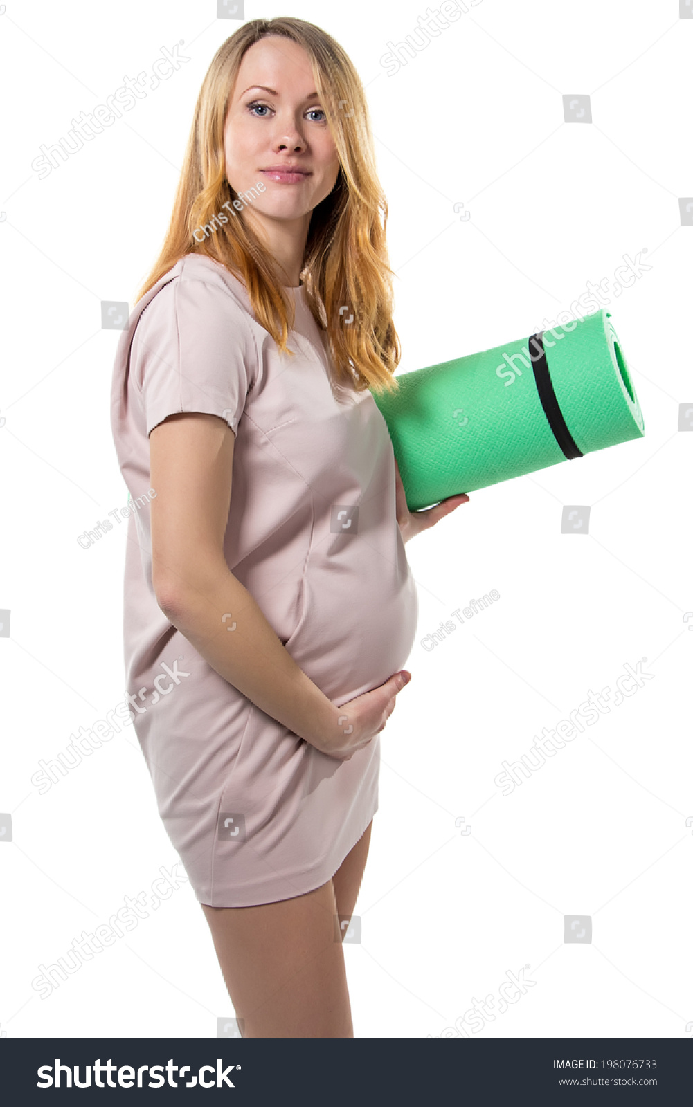 Pregnant woman going to the gym isolated photo Pregnant woman going to the gym isolated photo