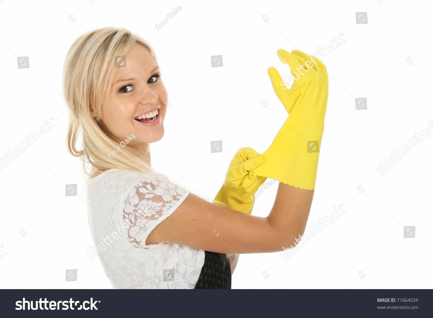 Pretty Blond Cleaning Lady Putting On Yellow Latex Gloves Stock Photo