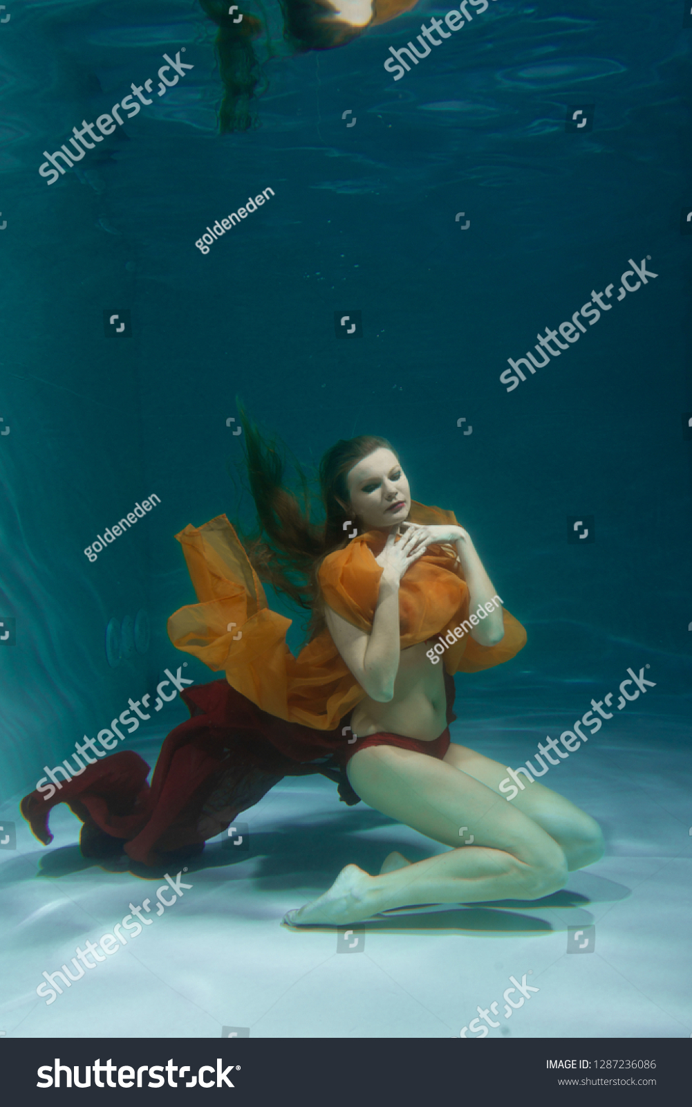 Pretty Caucasian Long Hair Woman Swimming Stock Photo