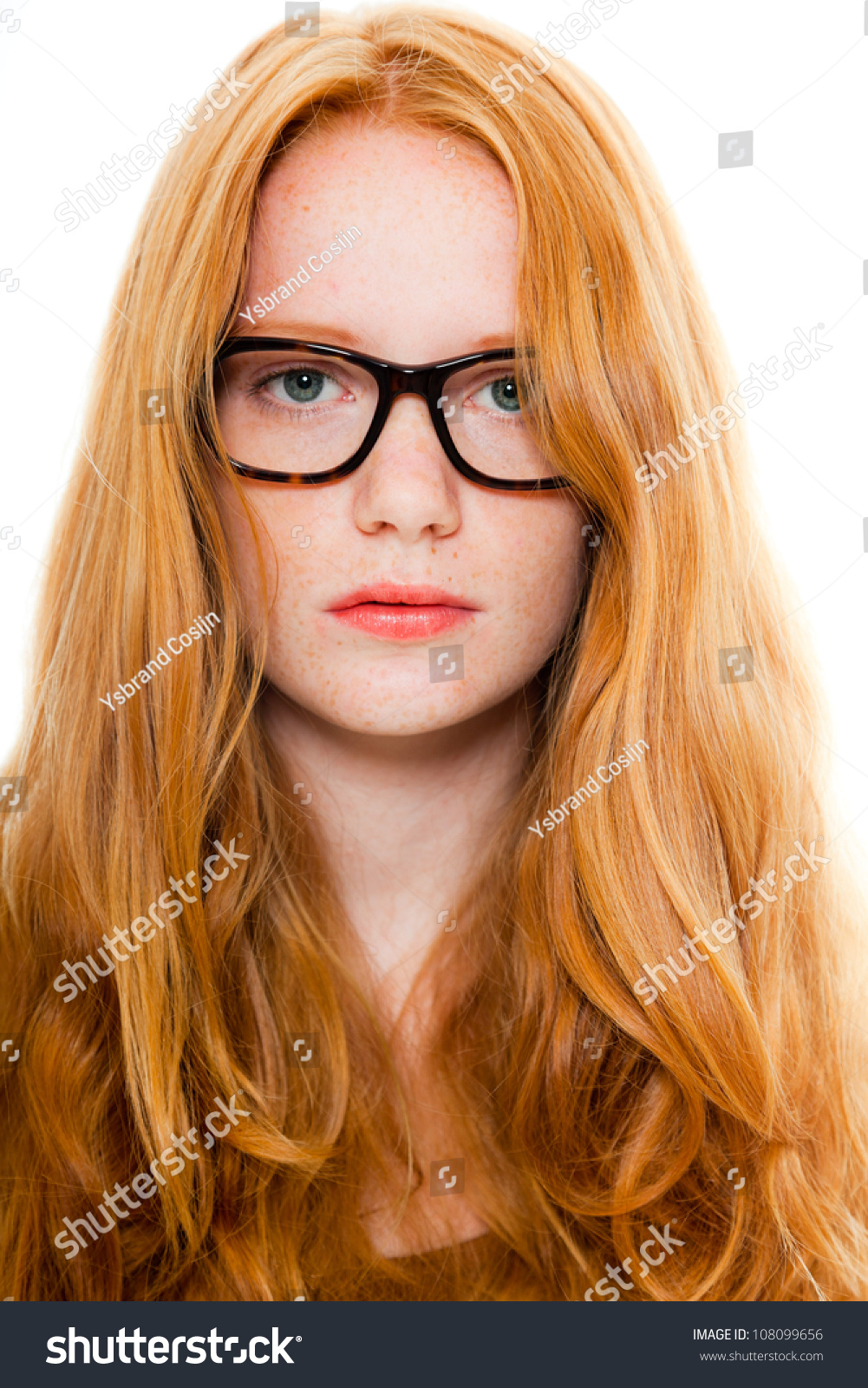 Pretty Girl With Long Red Hair Wearing Brown Shirt And Vintage Glasses