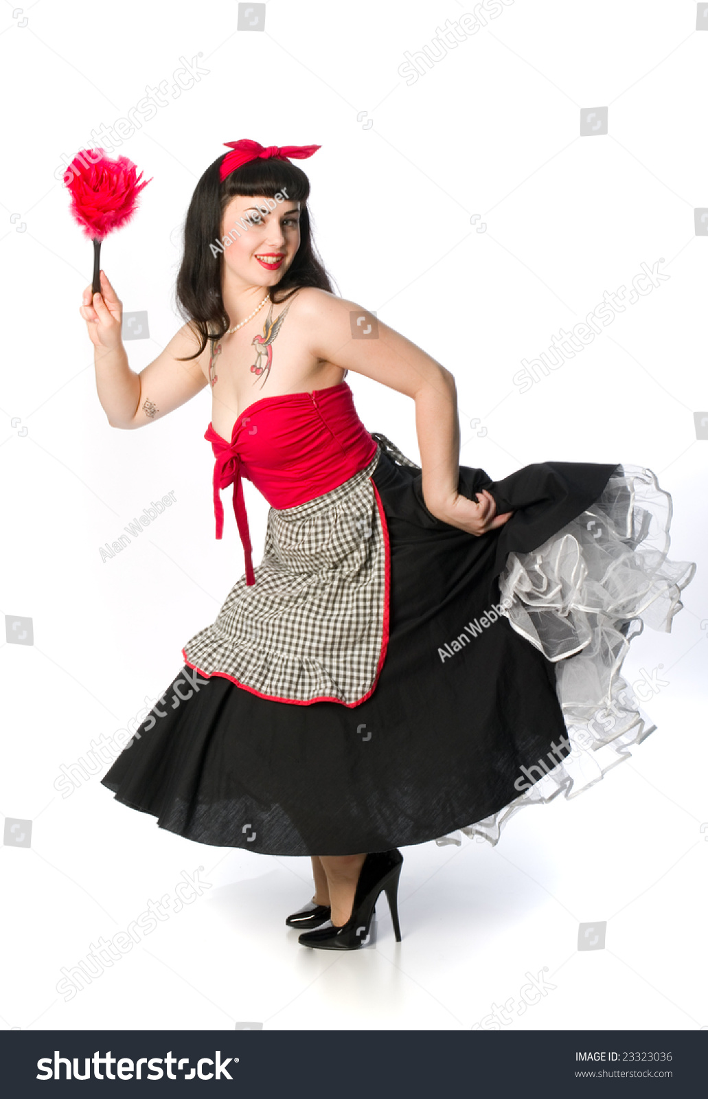 Pretty 50'S Pin Up Style Model In Housewife Clothing With Feather ...