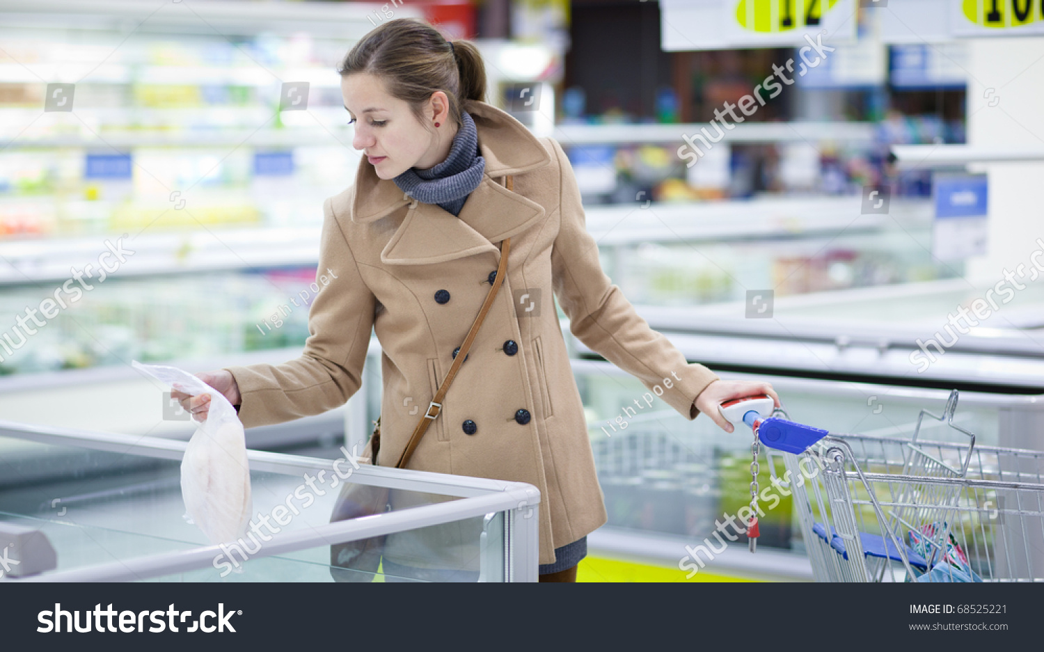 Pretty Young Woman Buying Groceries In A Supermarket/Mall/Grocery Store (Color Toned Image