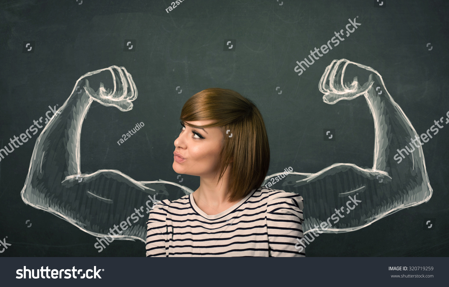 Pretty young woman with sketched strong and muscled arms Pretty young woman with sketched strong and muscled arms