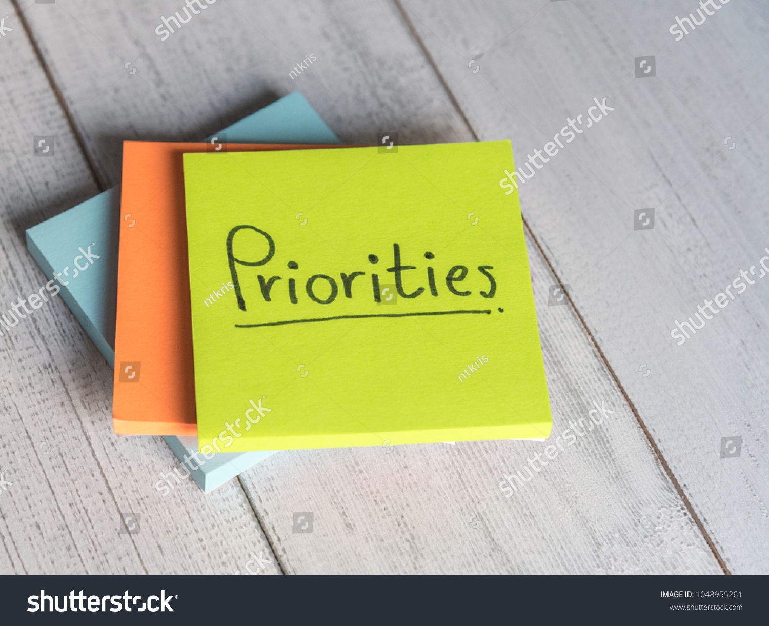 Priorities Reminder Handwriting On Sticky Note Stock Photo