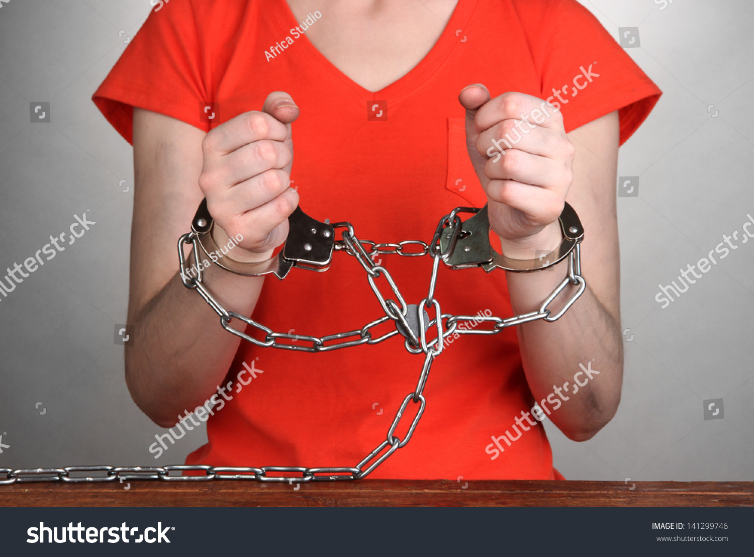 Prisoner Handcuffs On Grey Background Stock Photo 141299746 - Shutterstock