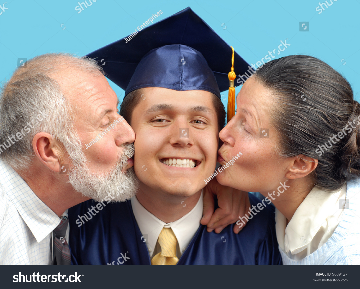 http://image.shutterstock.com/z/stock-photo-proud-parents-kissing-their-graduating-son-on-both-cheeks-9639127.jpg