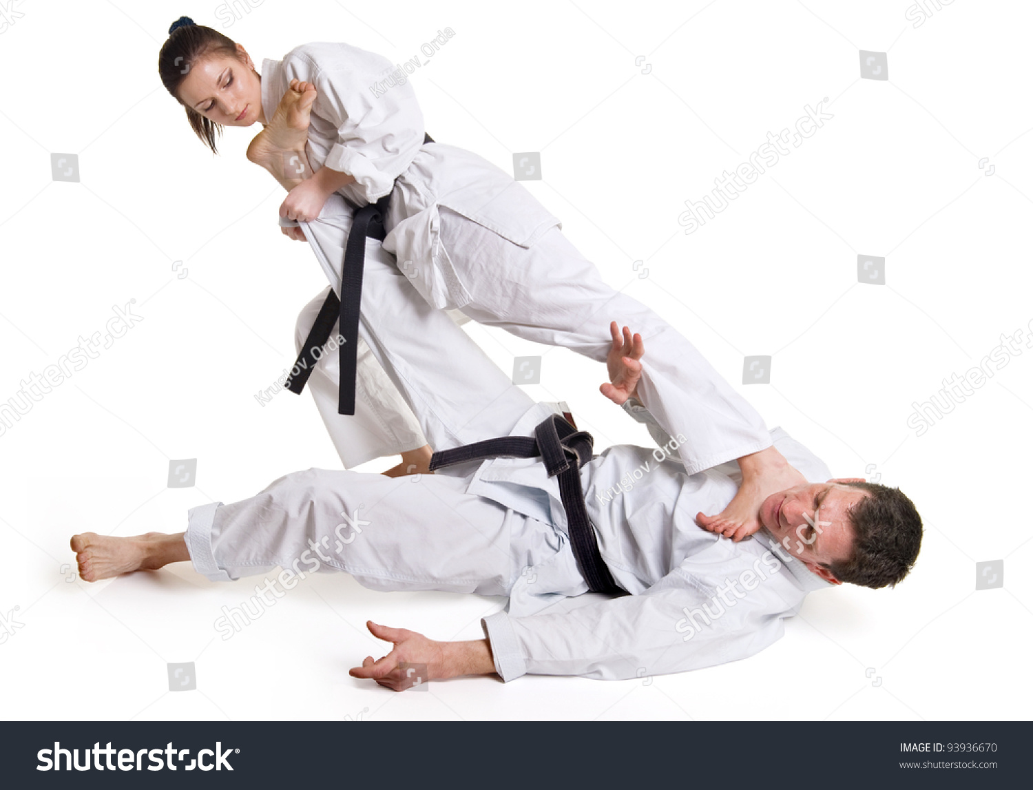 Punch.Figure In The Karate Fighting Stance On A White Background.HandToHand Fighting.Man And