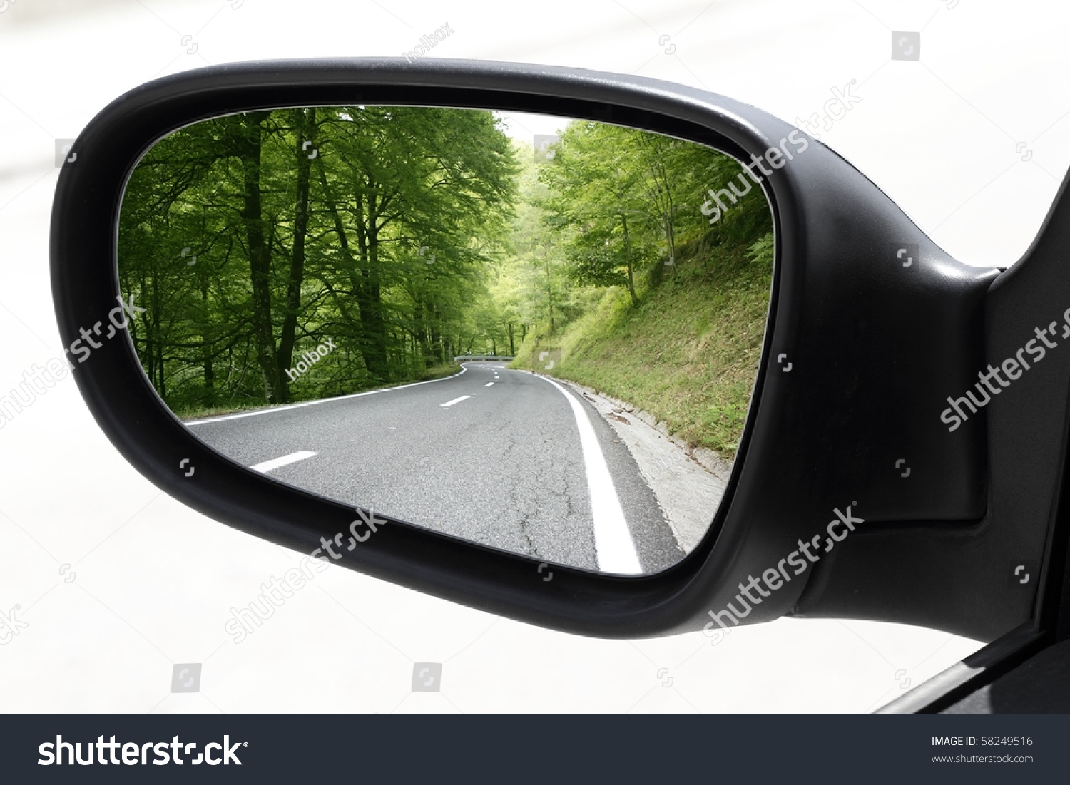 rearview car driving mirror view green forest road [Photo Illustration 