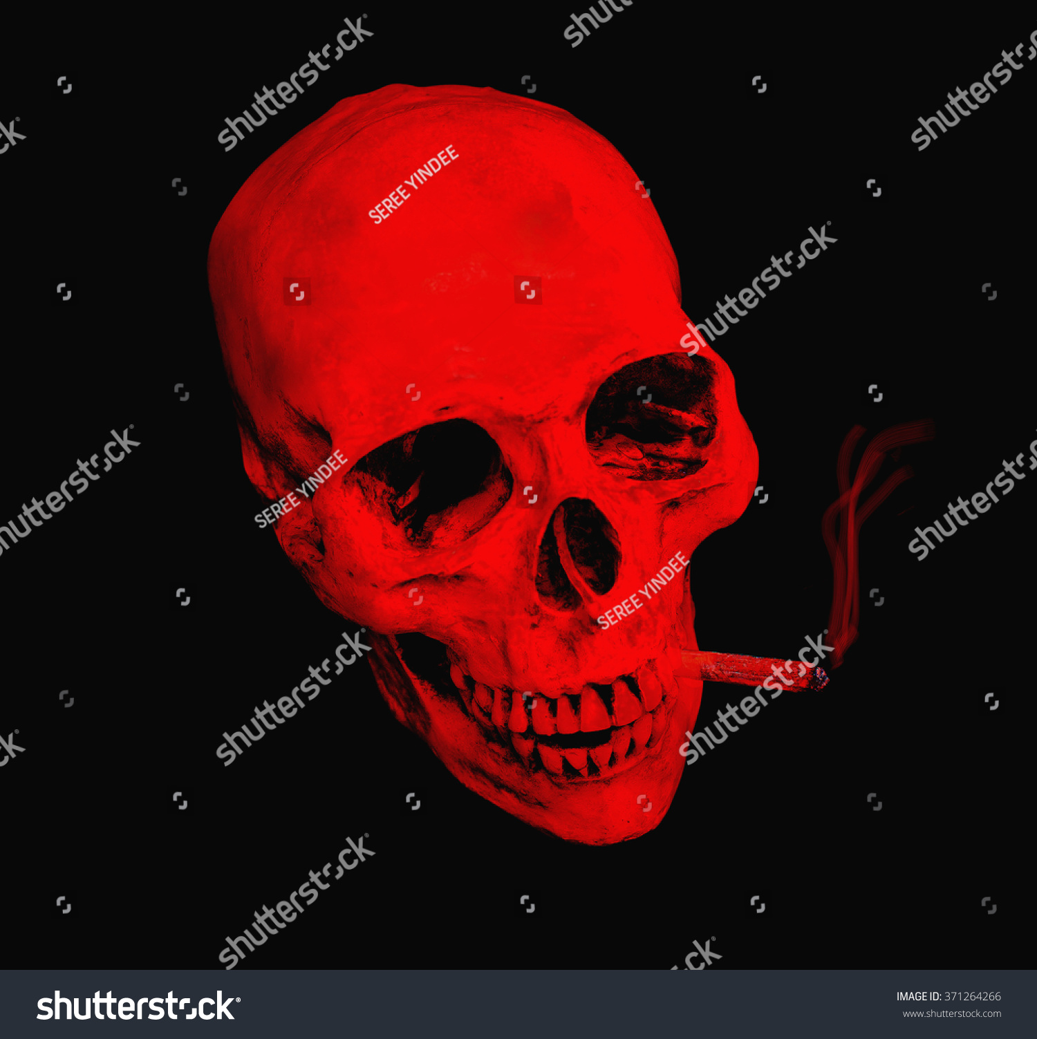 Red skull smoking marijuana cigarette with Clipping path Red skull smoking marijuana cigarette with Clipping path