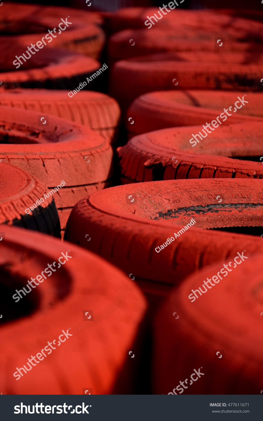 stock-photo-red-tire-barrier-on-a-race-t