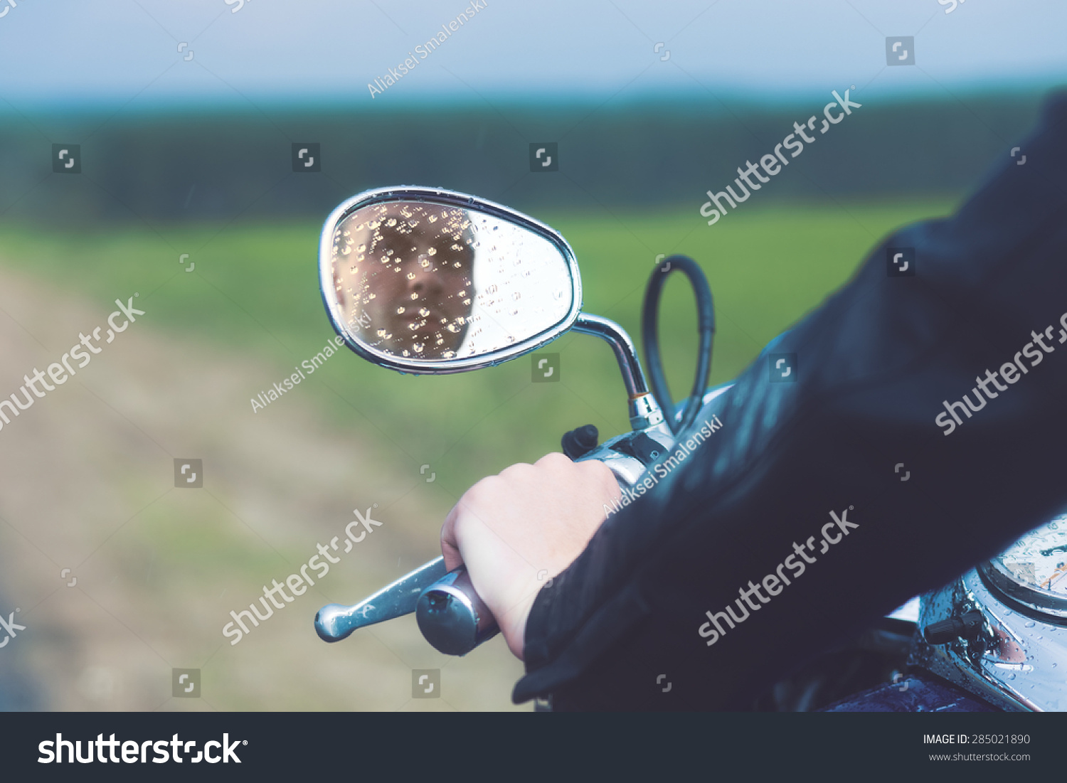 Reflection of Motorcycle Driver in Rearview Mirror Reflection of Motorcycle Driver in Rearview Mirror