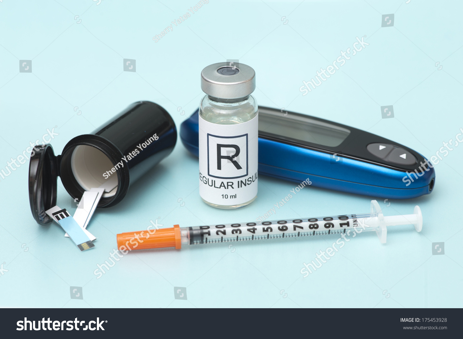 Regular Insulin With Test Strips, And Syringe. Stock Photo