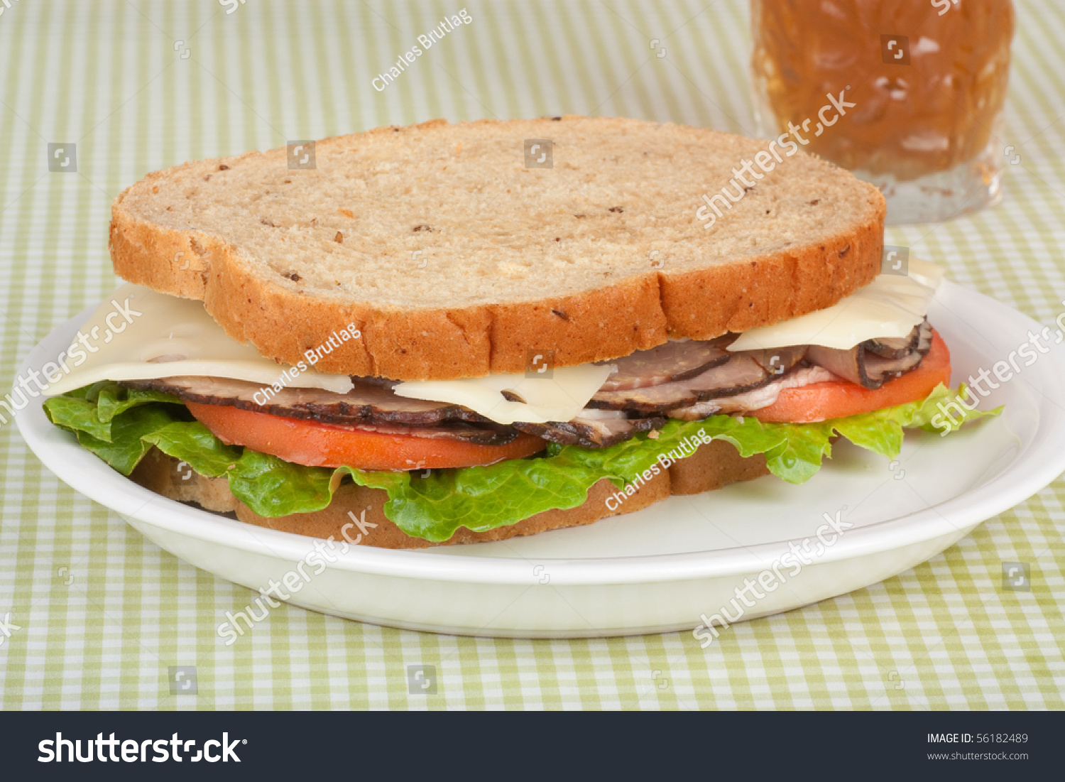 Roast Beef Sandwich On Rye Bread With Swiss Cheese, Tomato And Lettuce