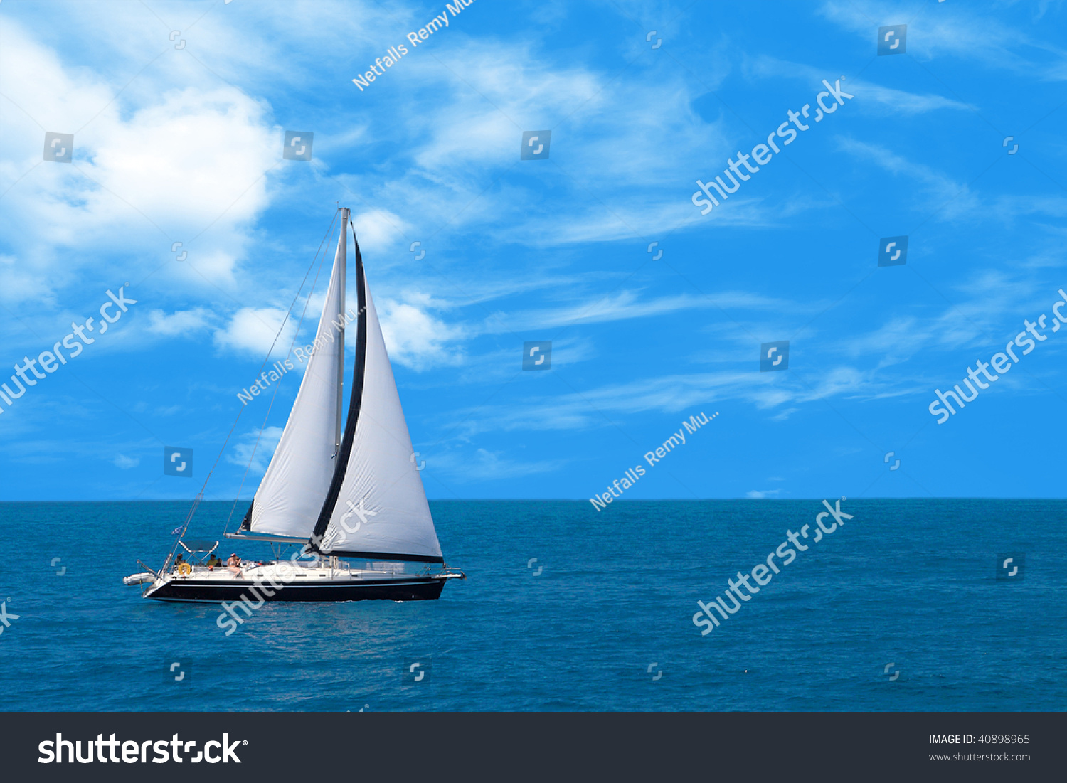 Sailboat Sailing In The Morning With Blue Cloudy Sky Stock Photo 