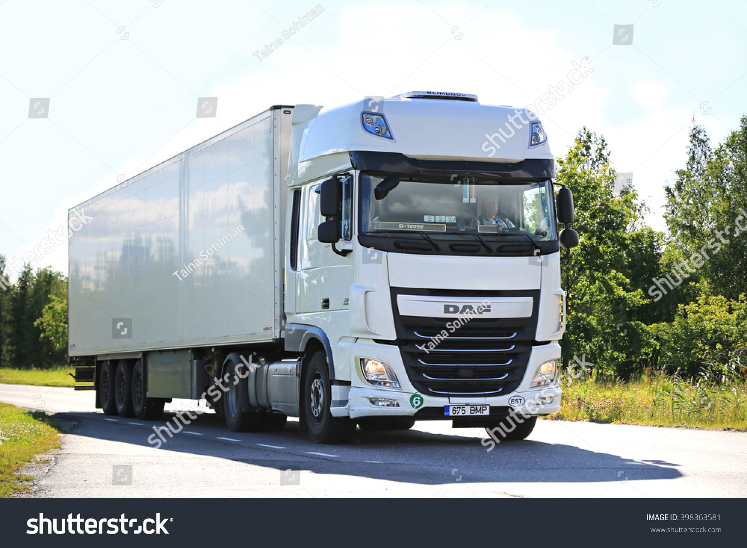 SALO FINLAND JULY 24 2015 New white DAF XF semi truck on summer road in Salo PACCAR reports strong revenues and net income for the Q3 of 2015 SALO FINLAND JULY 24 2015 New white DAF XF semi truck on summer road in Salo PACCAR reports strong revenues and net income for the Q3 of 2015