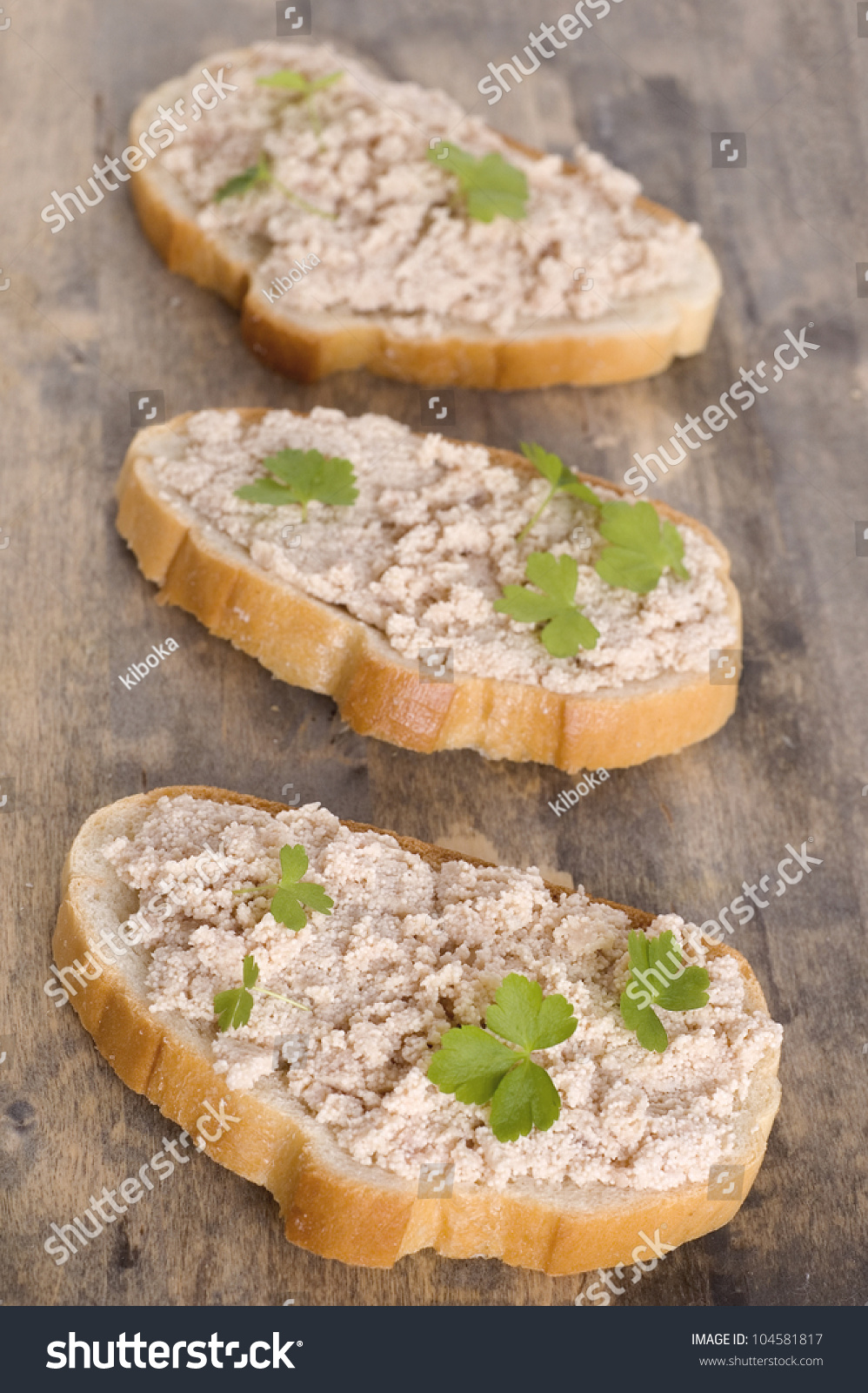 sandwiches-with-fish-paste-on-wooden-background-stock-photo-104581817