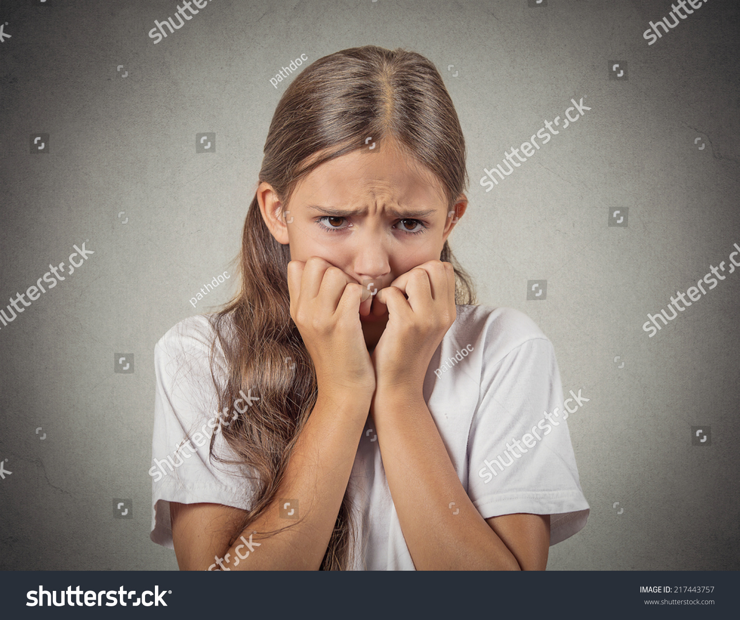 Scared Shy Closeup Portrait Nervous Anxious Stressed Teenager Girl Biting Fingernails Looking