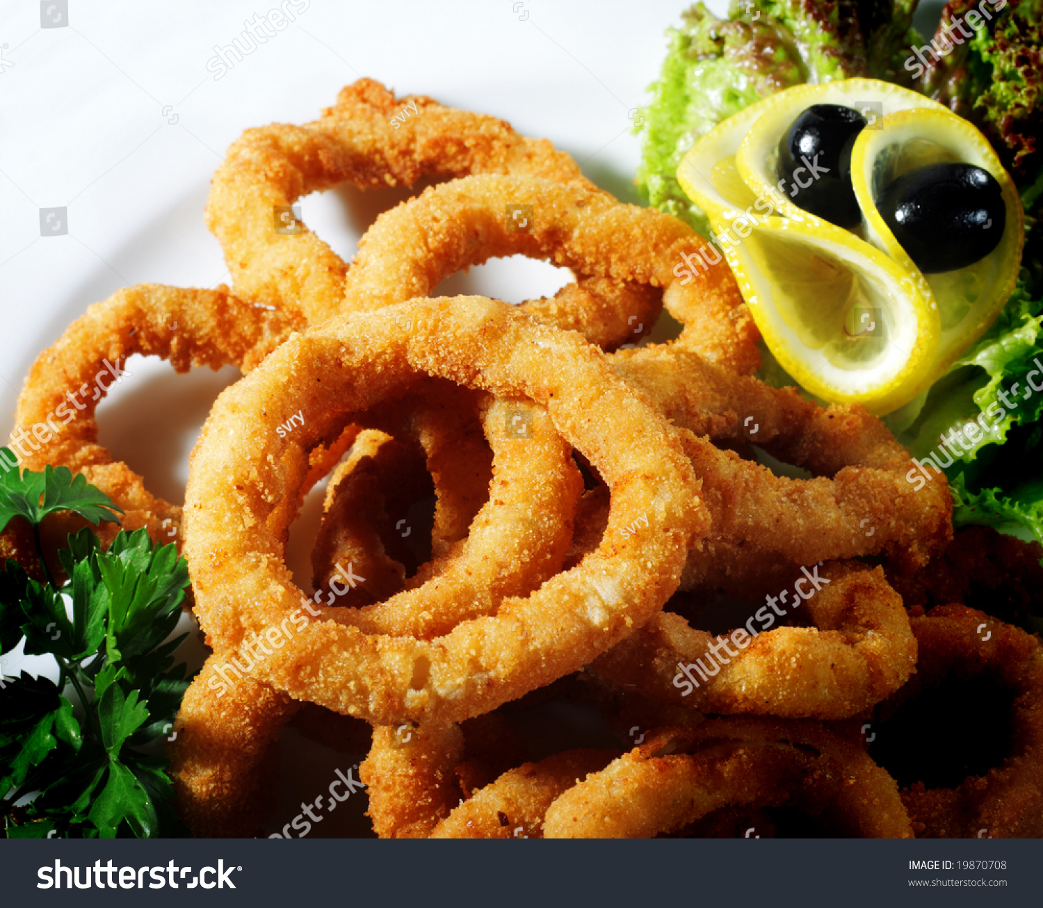Seafood - Fried Calamari. Deep-Fried Squid Dressed With Salad Leaves