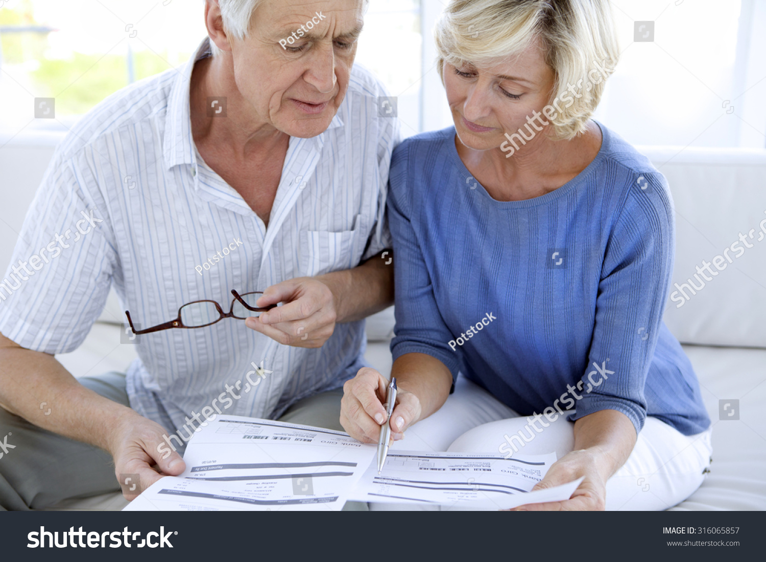 Senior couple doing home finances Senior couple doing home finances