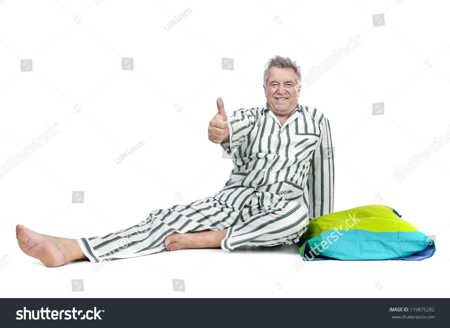 Senior man in pajamas isolated in white Senior man in pajamas isolated in white