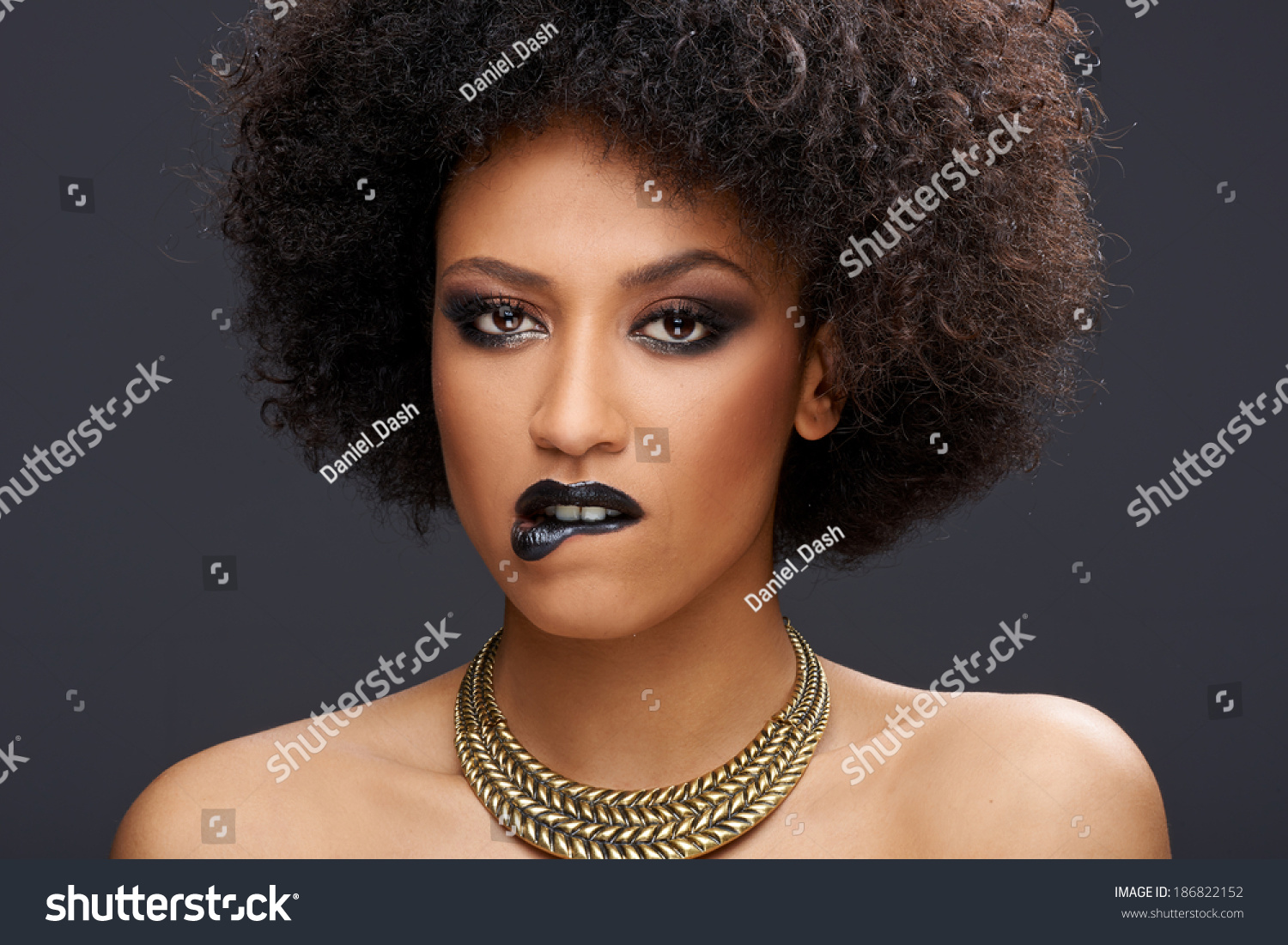 Sensual Elegant African American Woman With Bare Shoulders Wearing A Stylish Gold Choker And