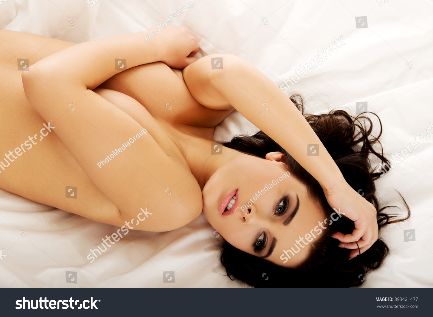 Sensual Topless Woman Lying On Bed