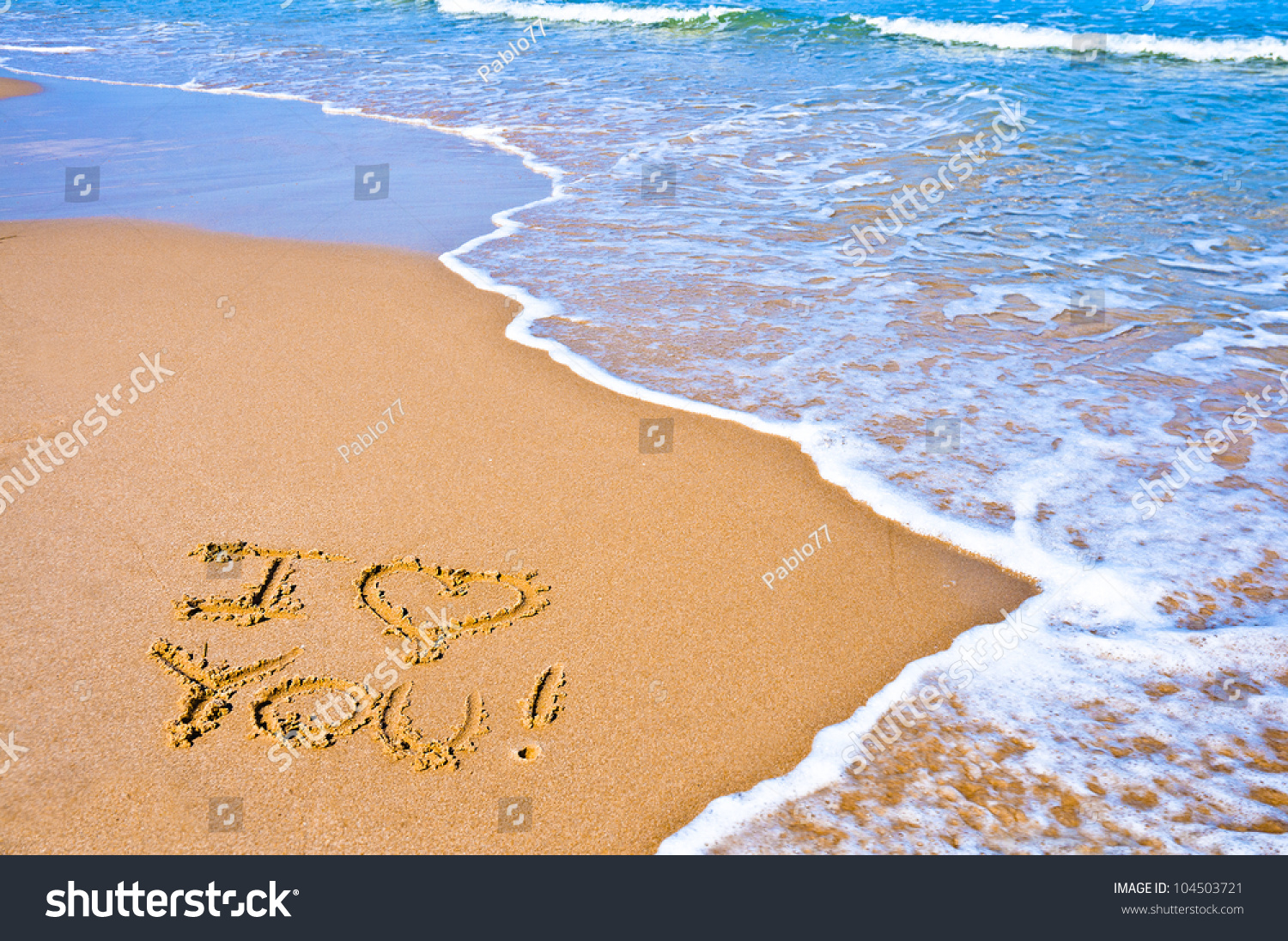 sentence-i-love-you-written-on-the-sand-of-a-beach-stock-photo-104503721-shutterstock