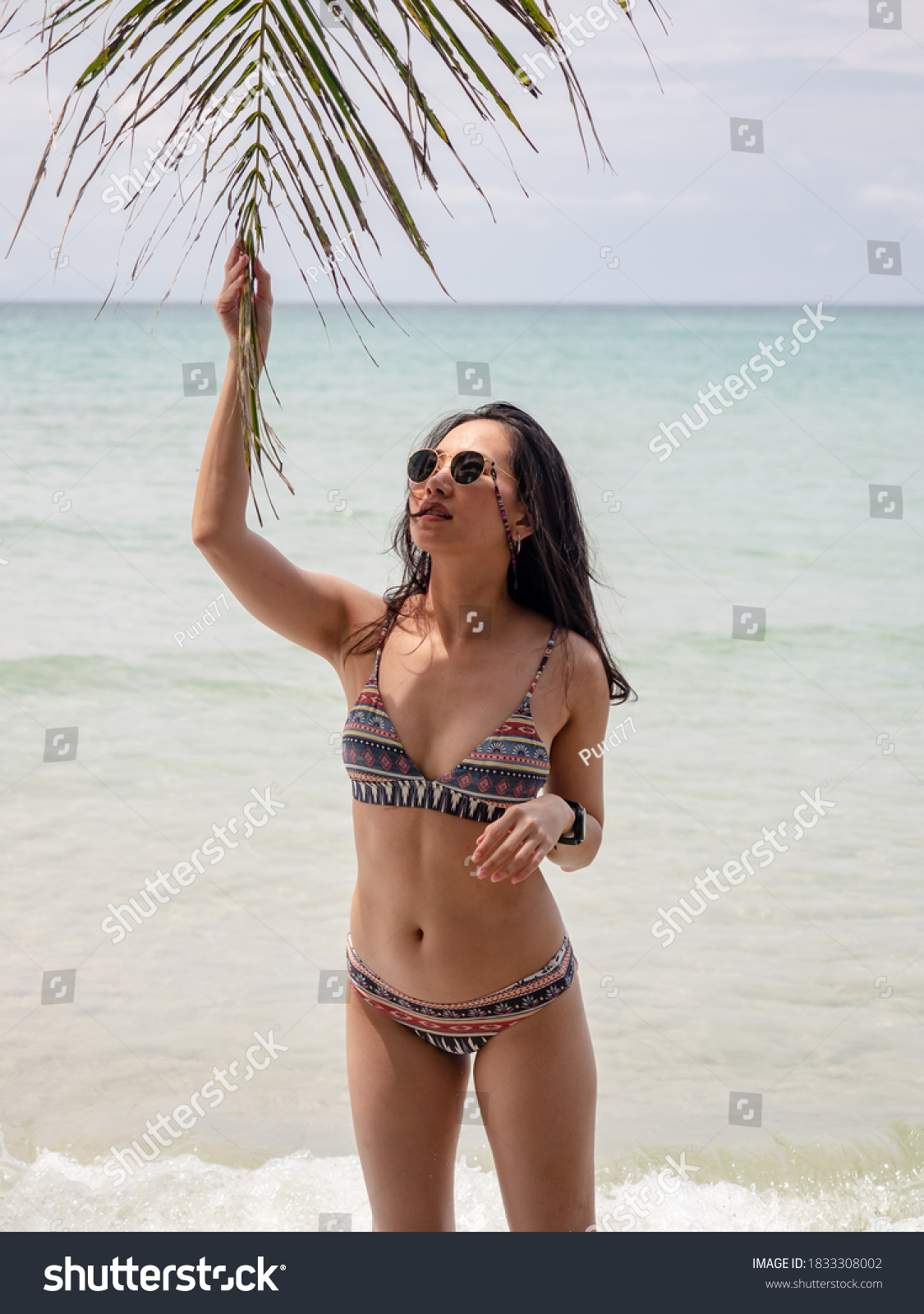 Sexy Asian Woman Bikini Posture Coconut Stock Photo