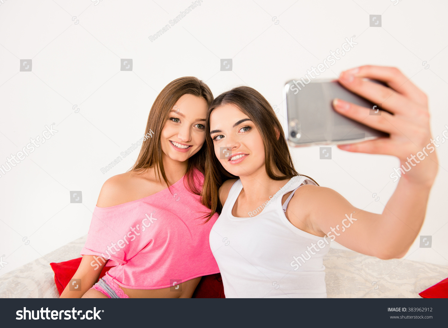 Sexy Attractive Girls In Pajamas Making Selfie In Bedroom Stock Photo