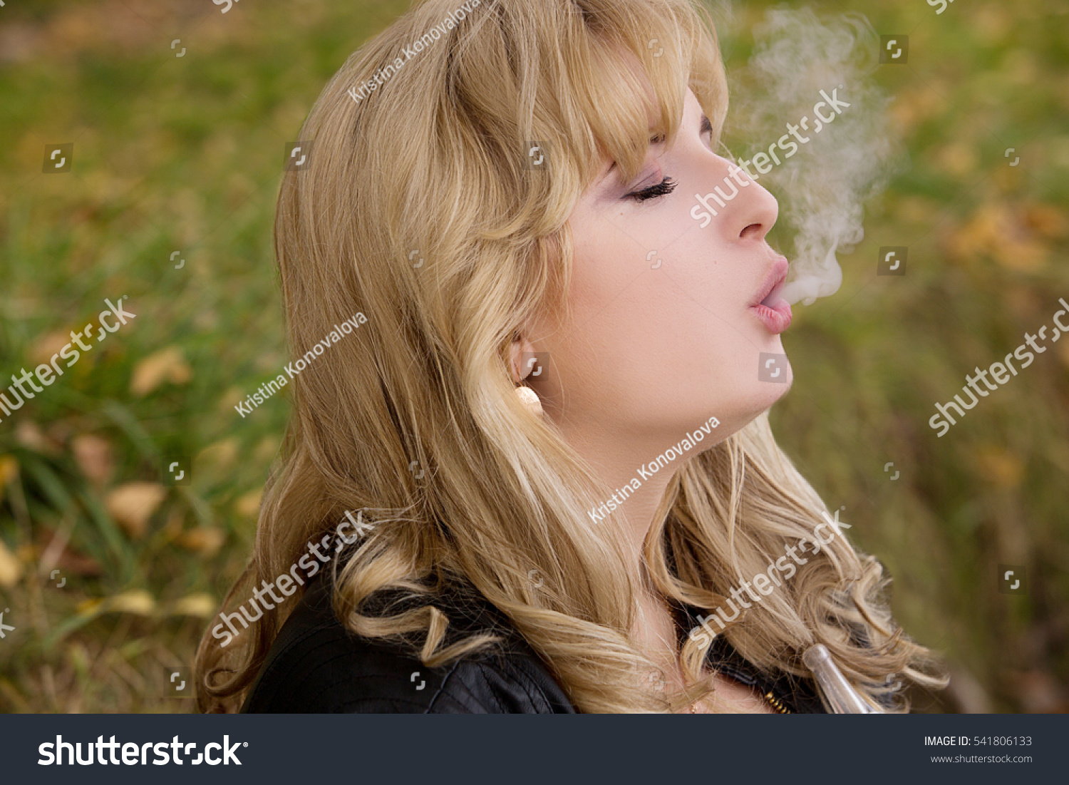 Sexy Blonde Big Breasts Smokes Hookah